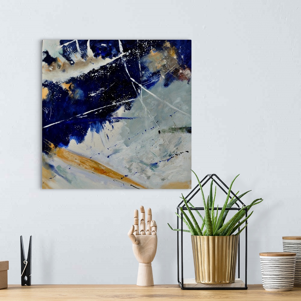A bohemian room featuring A square abstract painting of colors of brown, white and blue in bold brush strokes and splattere...