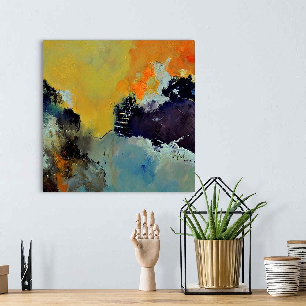 A bohemian room featuring Abstract painting in shades of yellow, blue, gray and orange mixed in with black contrasting desi...