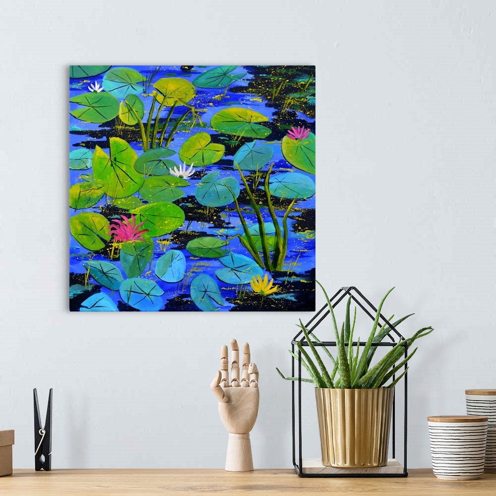 A bohemian room featuring Square painting of blue and green water lilies with flower blooms and small speckles of paint ove...