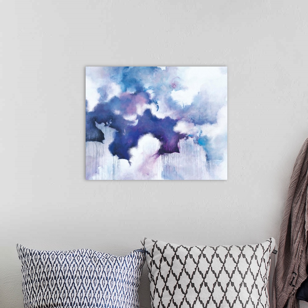 A bohemian room featuring Abstract contemporary painting in blue and purple tones, resembling a cloudy sky.