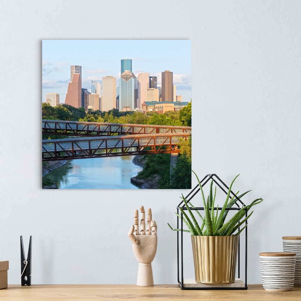 A bohemian room featuring Square photograph of the Houston TX skyline in the distance with the  Rosemont pedestrian bridge ...