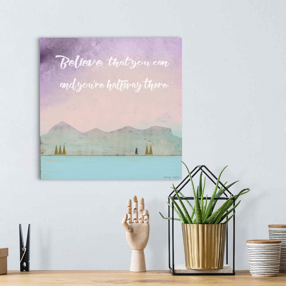 A bohemian room featuring "Believe That You Can And You're Halfway There" in white above a nature scene of a hiker among mo...