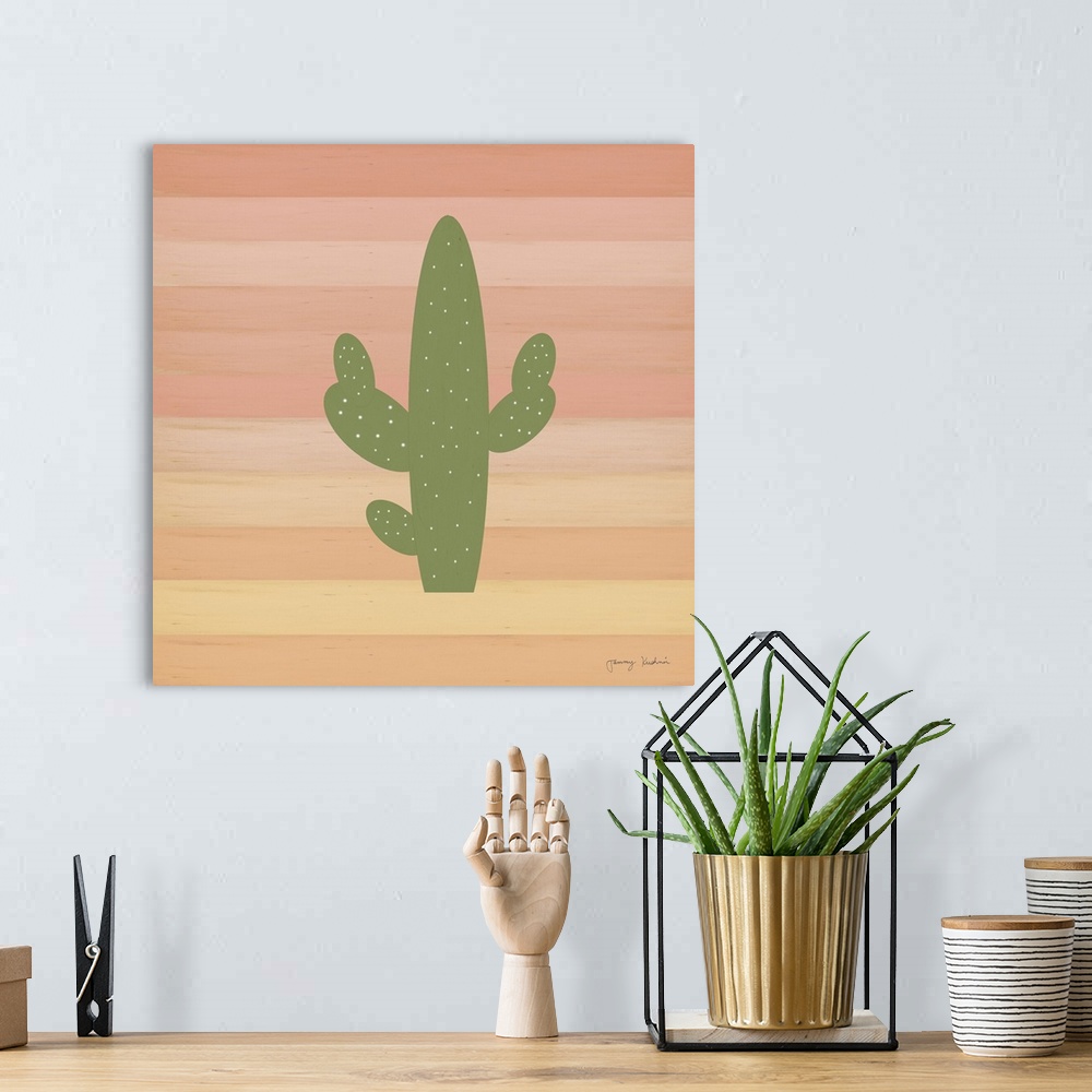 A bohemian room featuring Square decorative design of a green cactus on a striped background of shades of pink.