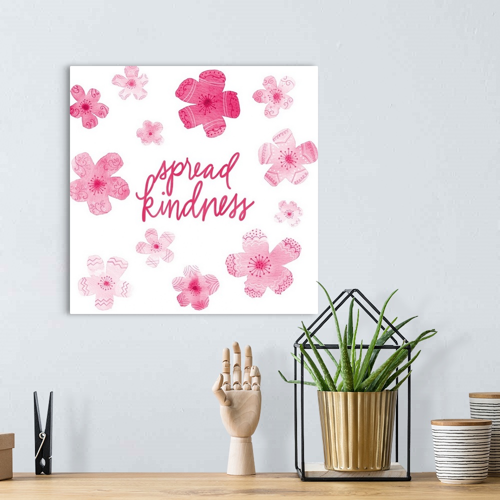 A bohemian room featuring "Spread Kindness" with pink flowers with different patterns on a white background.