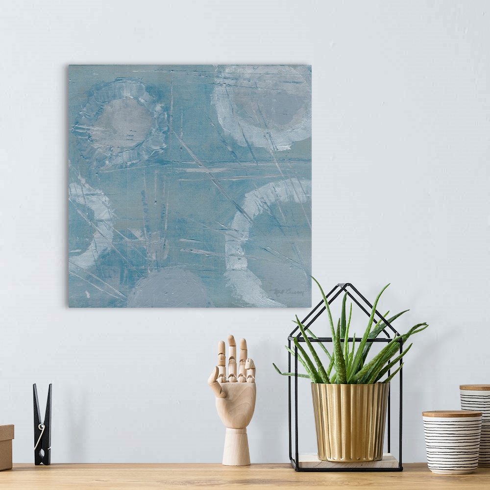 A bohemian room featuring Square abstract painting of textured faded white rings with thin angled streaks on a light blue b...
