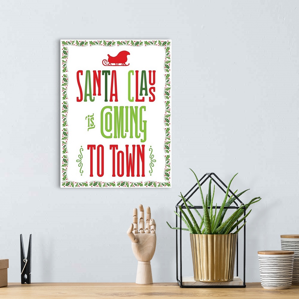 A bohemian room featuring "Santa Clause Is Coming To Town" in green and red with a holly border.