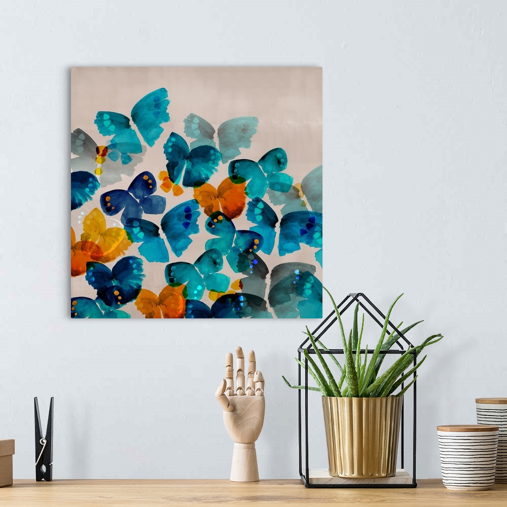 A bohemian room featuring Contemporary painting of colorful blue, orange and yellow butterflies on a gray background.