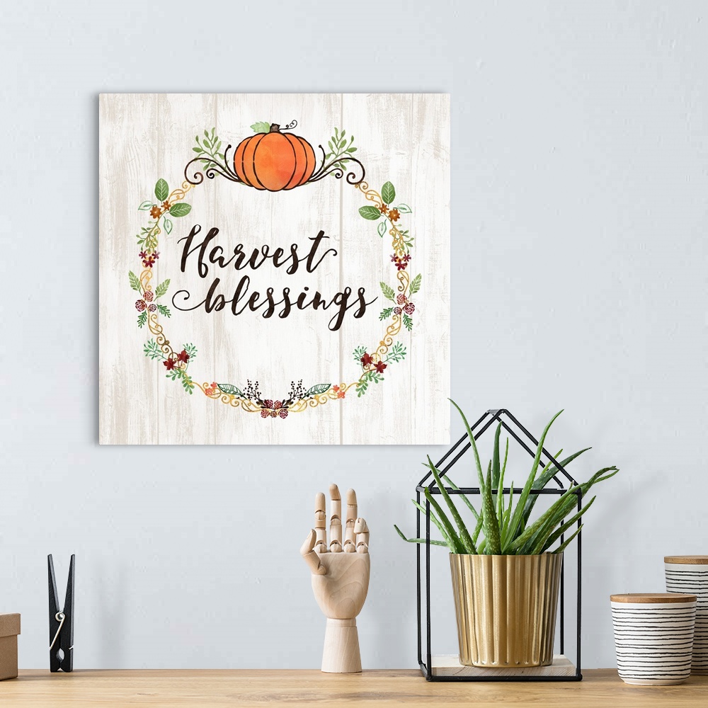 A bohemian room featuring "Harvest Blessings" with a seasonal wreath and pumpkin on a white wood backdrop.