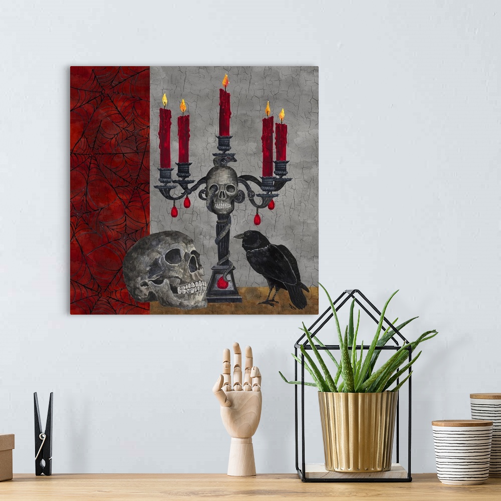 A bohemian room featuring A square decorative image of a human skull, candelabra and a raven surrounded by webs with a crac...