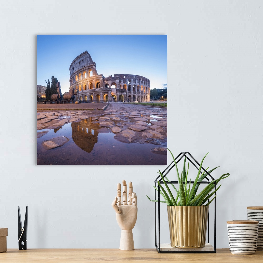A bohemian room featuring The Colosseum, reflected in a puddle at dusk, Rome, Lazio, Italy