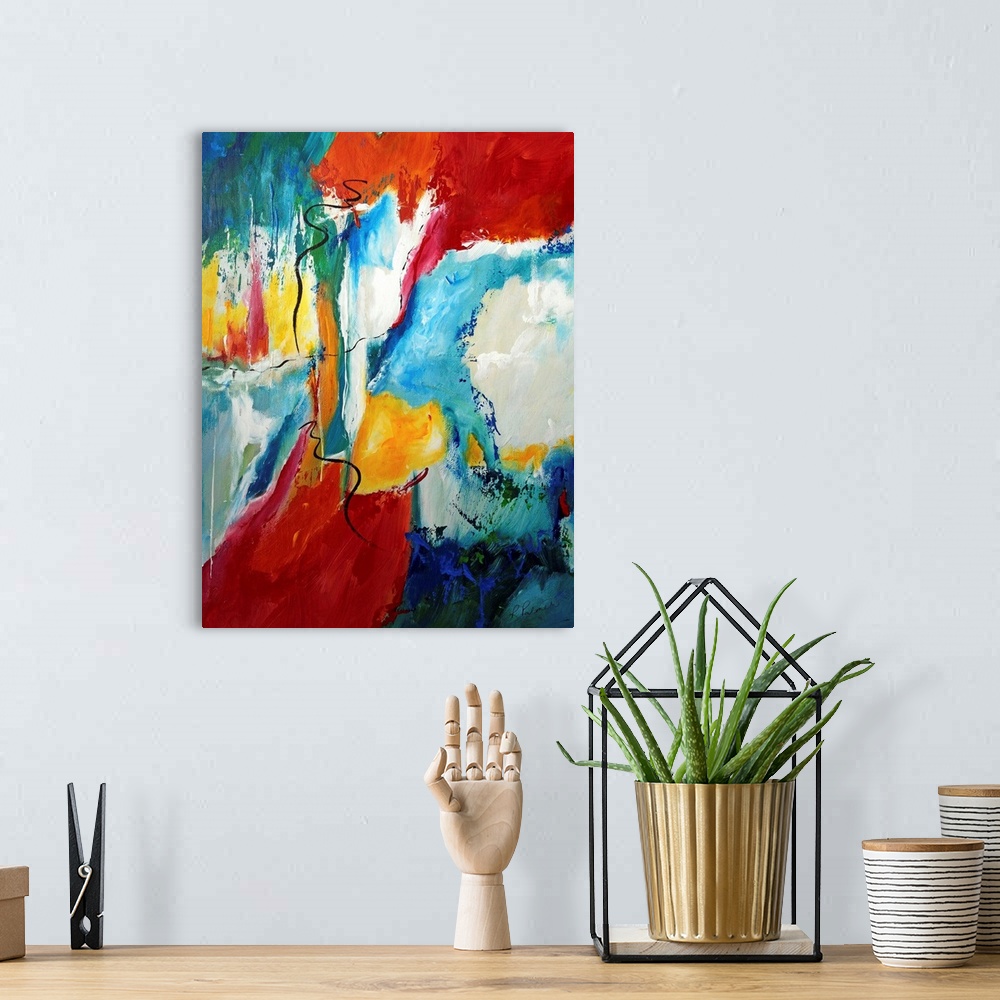 A bohemian room featuring Vertical abstract painting of splashes of bright colors with dark brush stroke scribbled over top.