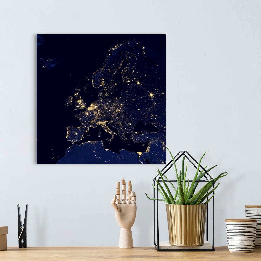 A bohemian room featuring Europe at night. Black marble satellite image of Europe at night. More densely populated areas ar...