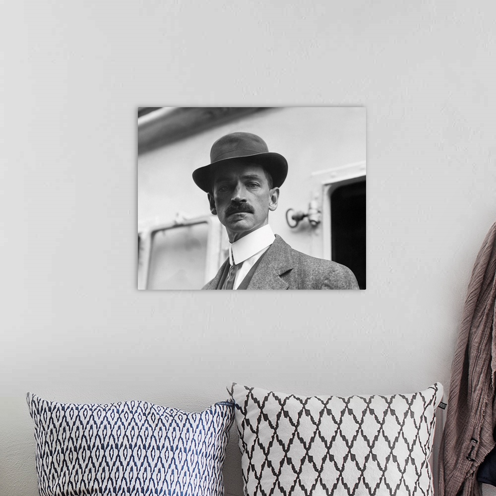 A bohemian room featuring American history photograph of Glenn Curtiss in an undated portrait.