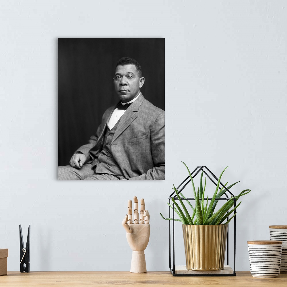 A bohemian room featuring American history portrait of Booker T. Washington, dated 1895.