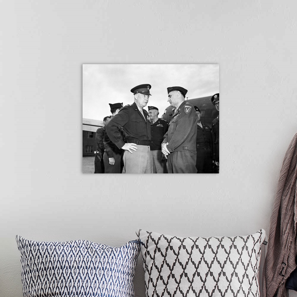 A bohemian room featuring General Dwight Eisenhower talking with General Lucius Clay at Gatow Airport in Berlin, Germany, 1...