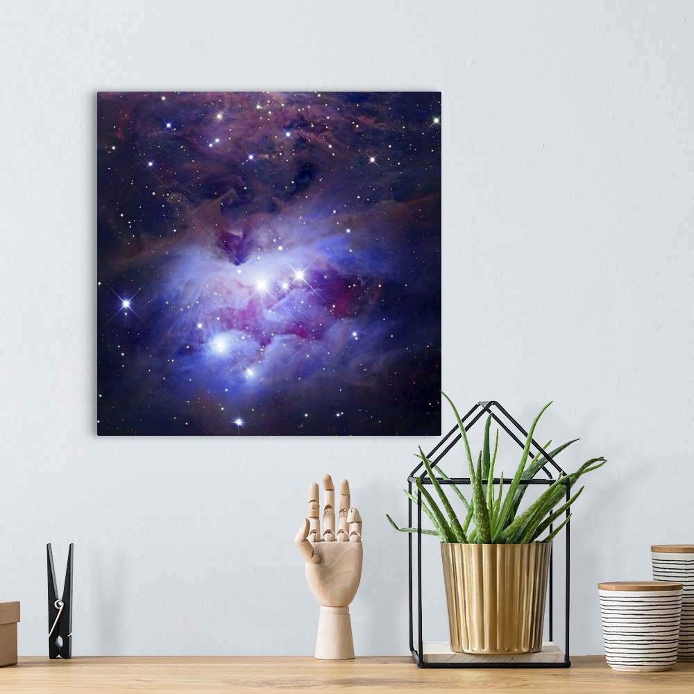 A bohemian room featuring Photograph of interstellar cloud of dust, hydrogen, and helium covered in stars.
