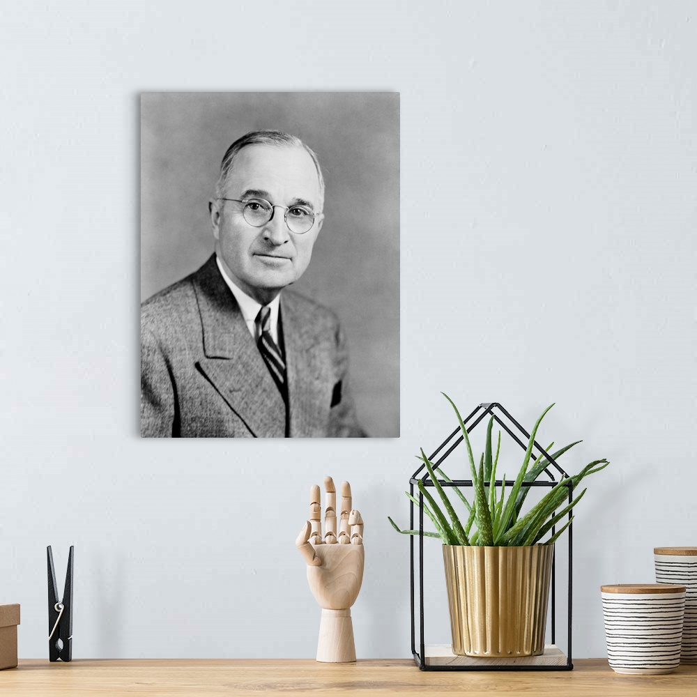 A bohemian room featuring Presidential history photograph of President Harry S. Truman.
