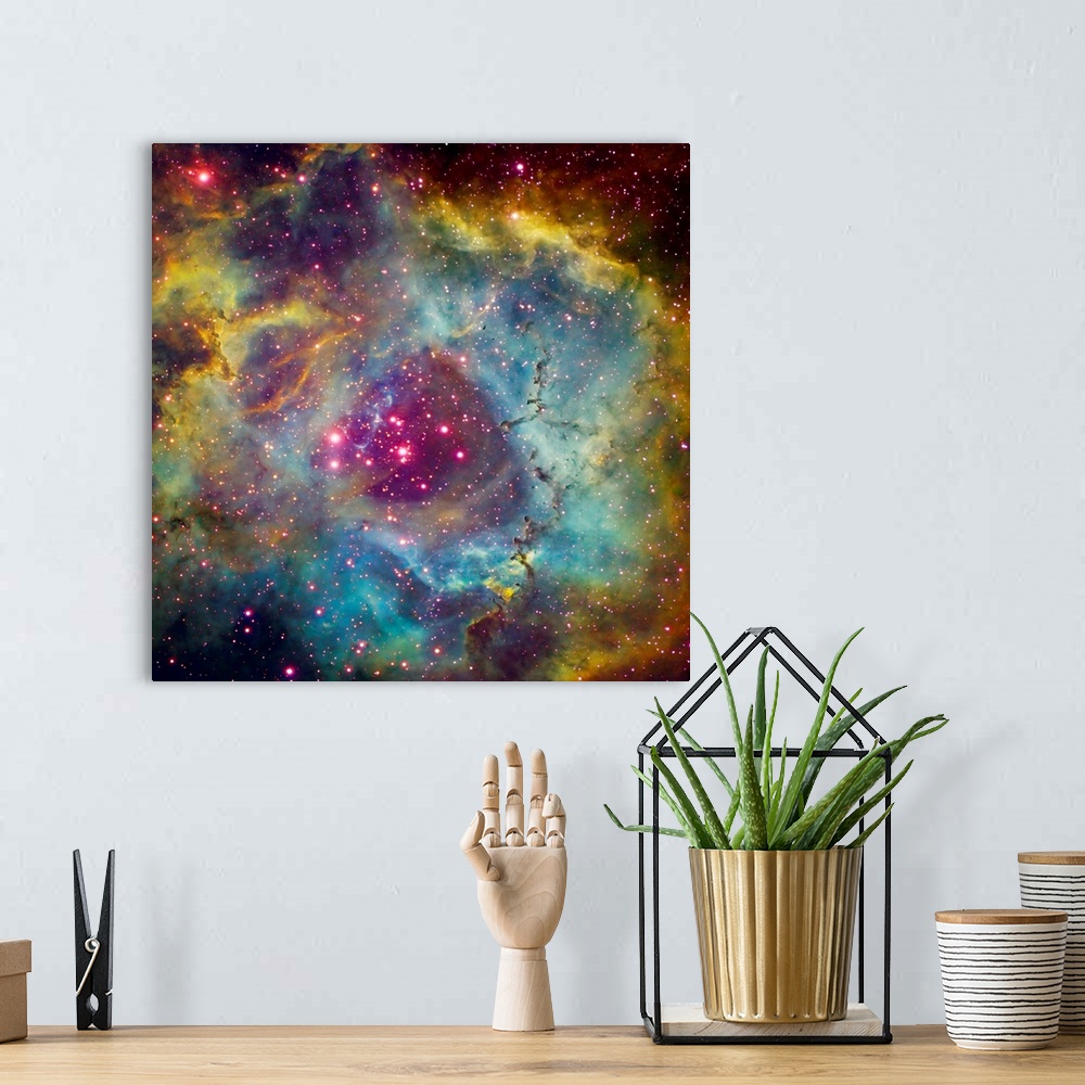 A bohemian room featuring Large square photograph taken of a star filled sky against the vibrant background of Rosette Nebu...