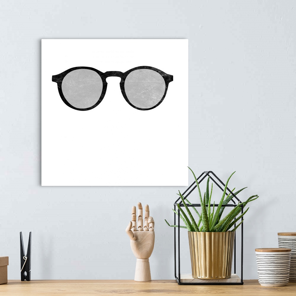A bohemian room featuring A pair of black and gray glasses on a solid white background.