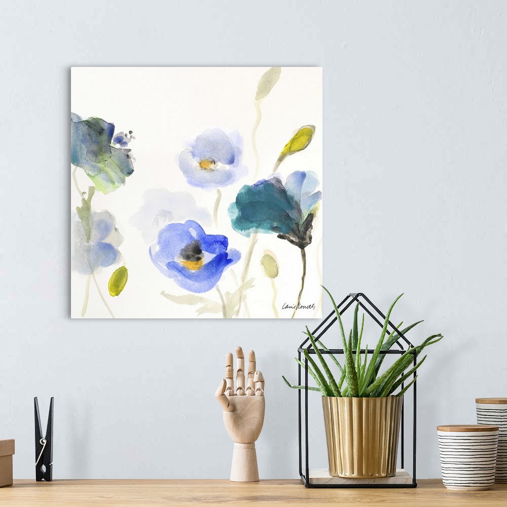 A bohemian room featuring A watercolor painting of blue poppy flowers.