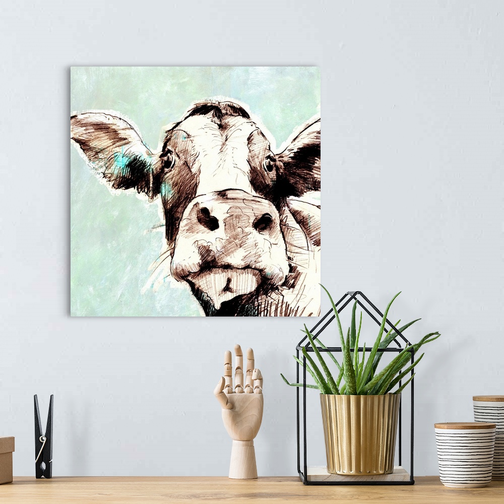A bohemian room featuring Contemporary artwork of a cow against a muted pale blue background.