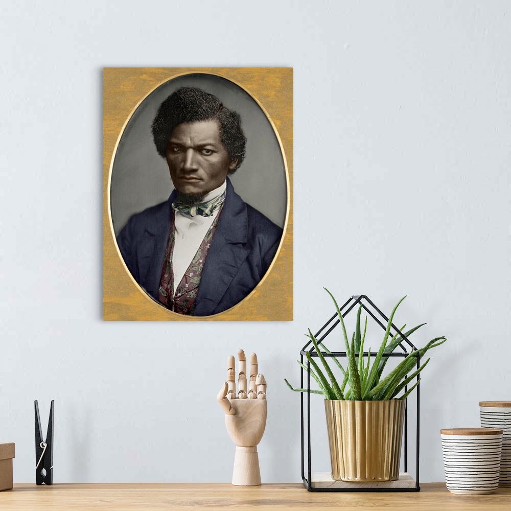 A bohemian room featuring FREDERICK DOUGLASS (c1817-1895). American abolitionist. Colorized daguerreotype by Samuel J. Mill...