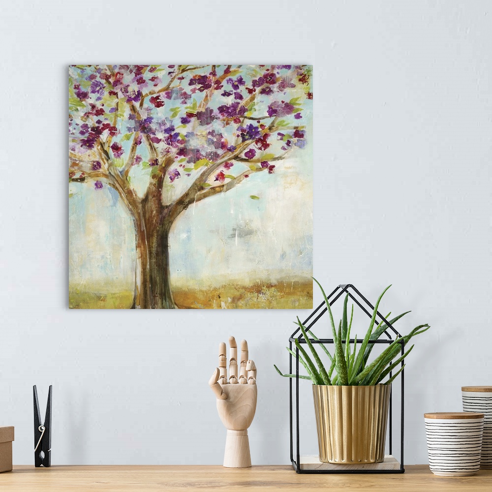 A bohemian room featuring Contemporary painting of a tree with purple blossoming flowers.