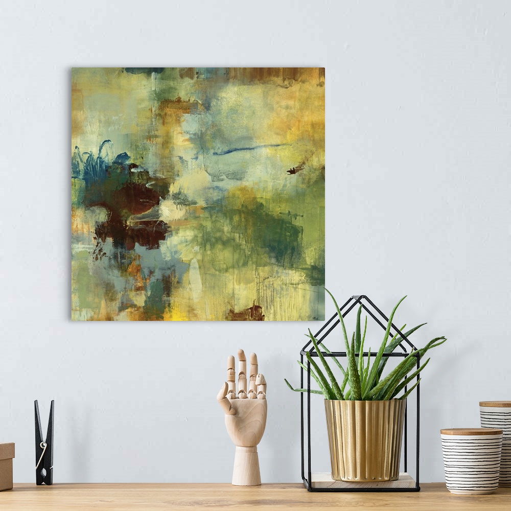 A bohemian room featuring Abstract art piece with splashes of muted paint colors and paint drips running down the art.