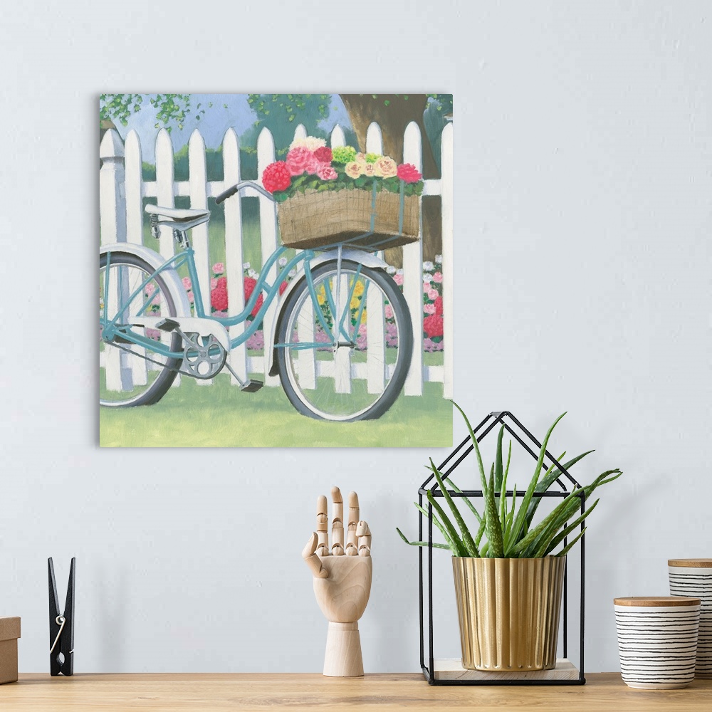 A bohemian room featuring Square contemporary painting of a blue bicycle and a front basket of flowers leaning on a white p...