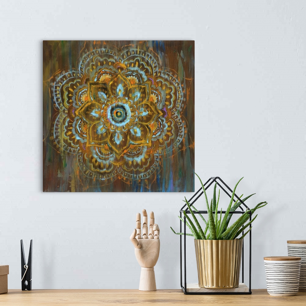 A bohemian room featuring Square abstract painting of a flower mandala with blue, orange, yellow, and brown hues and hints ...