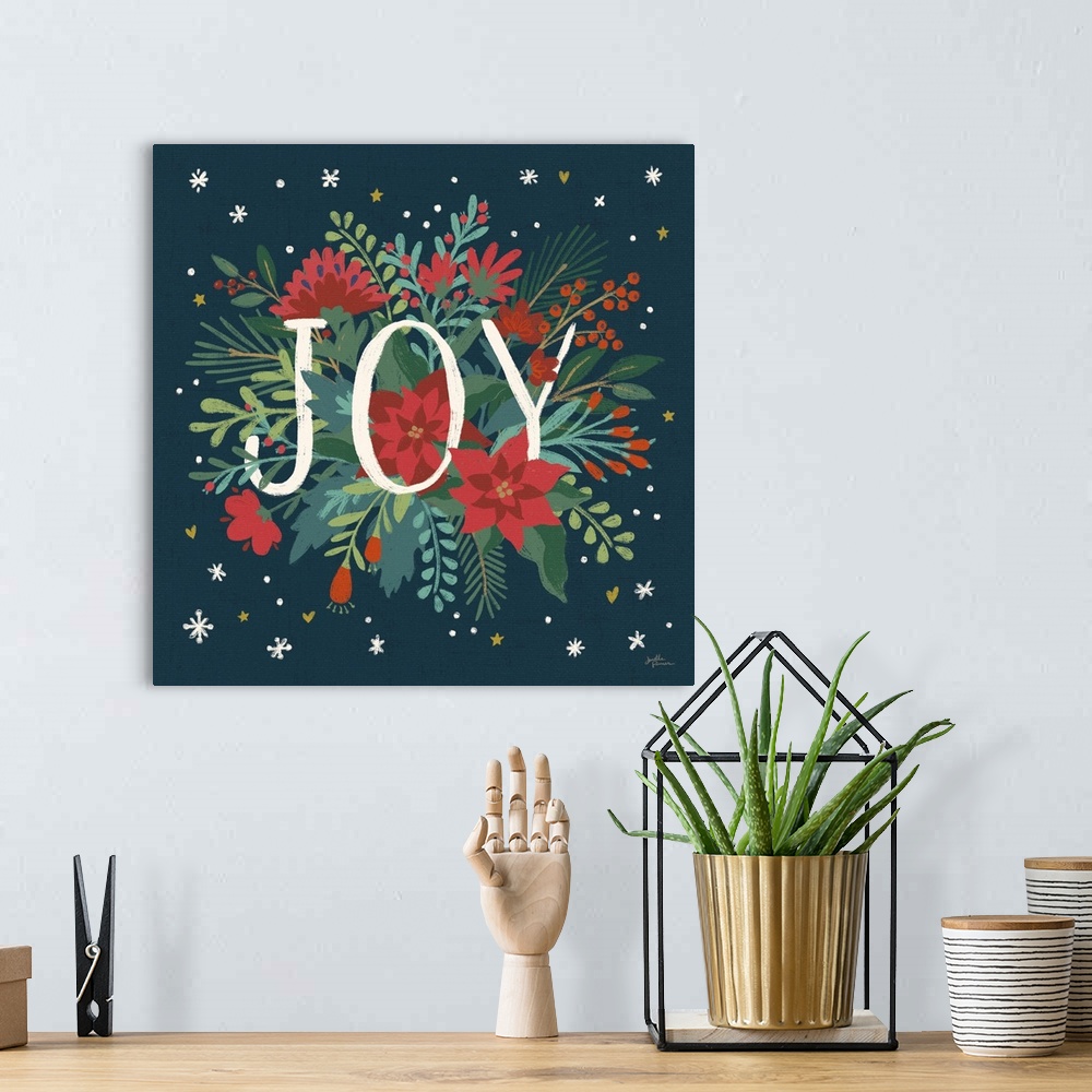 A bohemian room featuring Decorative artwork of red flowers and leaves with the text "Joyy" on a dark navy background.
