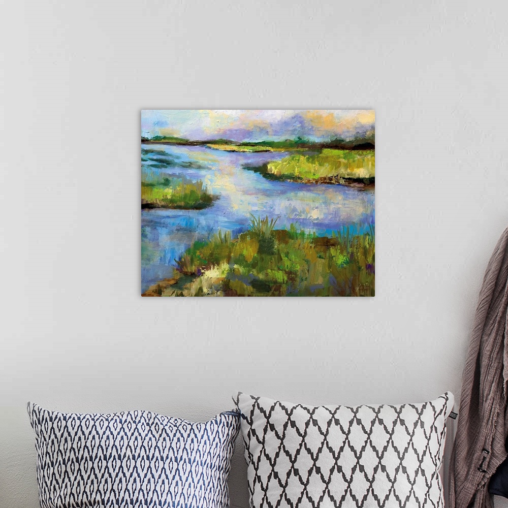 A bohemian room featuring Contemporary landscape painting of a stream running through a marsh.