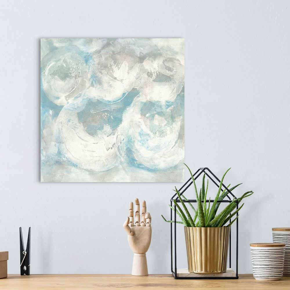 A bohemian room featuring Square abstract painting of textured swirls of white and blue.