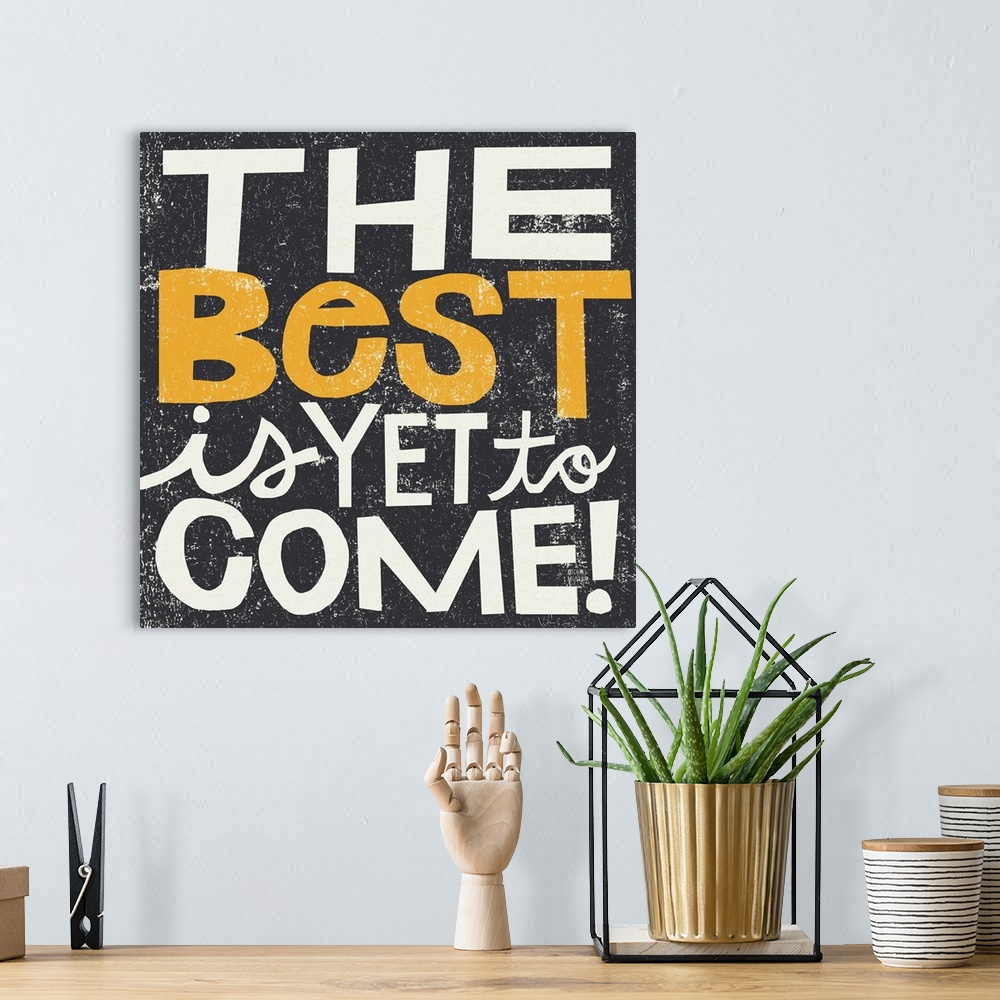 A bohemian room featuring Inspirational wall art featuring bright typography with the words the best is yet to come atop a ...