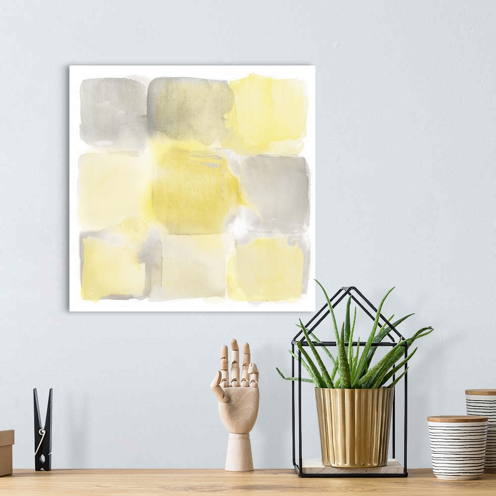 A bohemian room featuring Simple watercolor painting of yellow and gray square shapes.