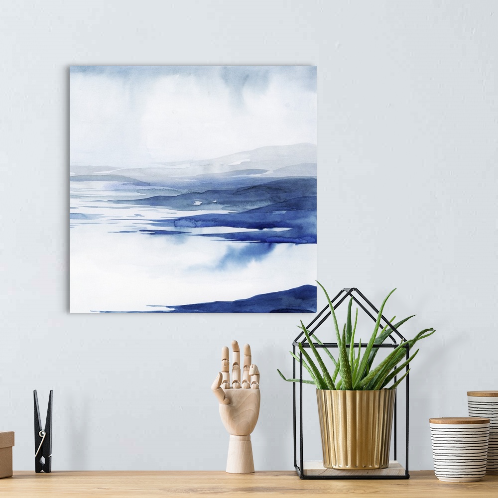 A bohemian room featuring Blue and white abstract artwork resembling rushing glacial water.