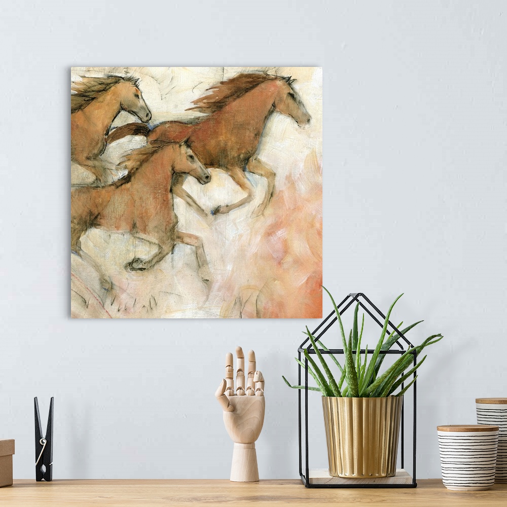A bohemian room featuring Contemporary painting of galloping horses.