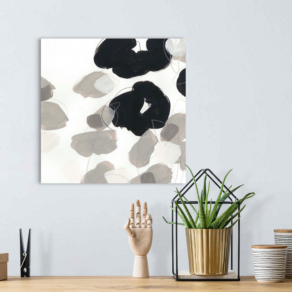 A bohemian room featuring Abstract floral painting with broad black shapes on white and grey.