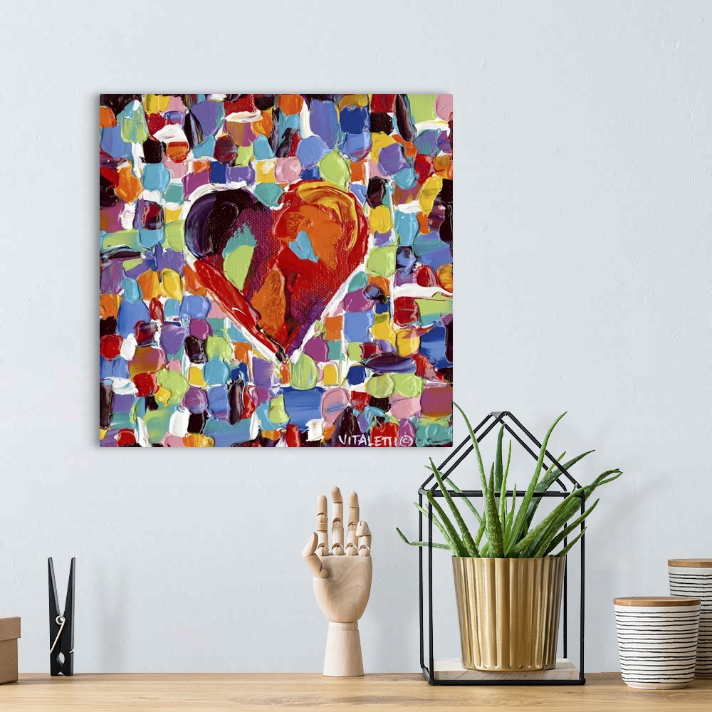 A bohemian room featuring Artwork of a technicolor heart on tiled squares with heavy dabs of paint and vivid colors.