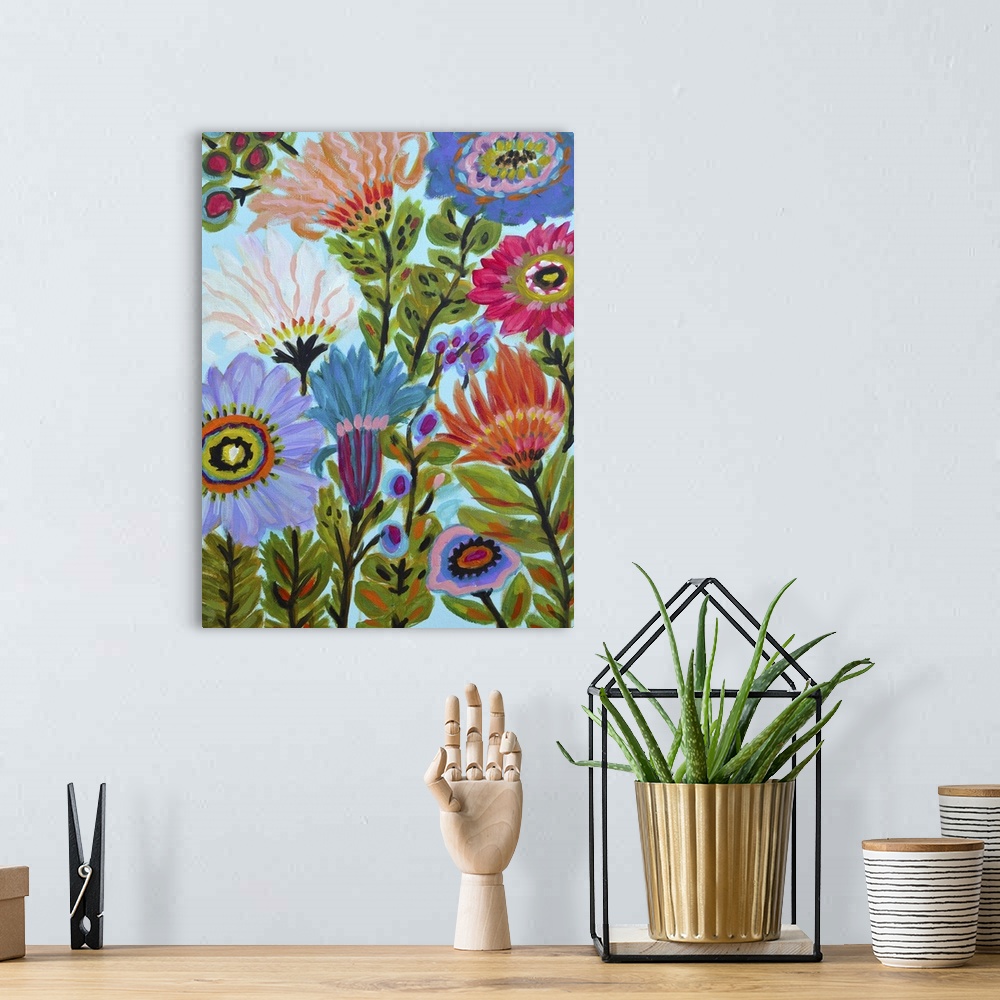 A bohemian room featuring Colorful contemporary artwork of folk style blooming flowers in a variety of sizes and colors.