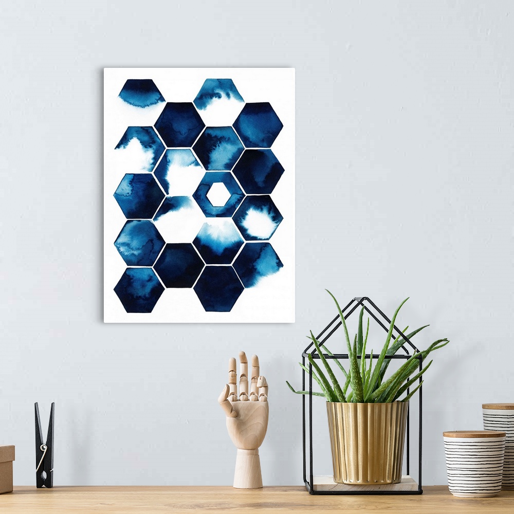 A bohemian room featuring Tiled honeycomb shapes, each with a dark blue watercolor splash inside.