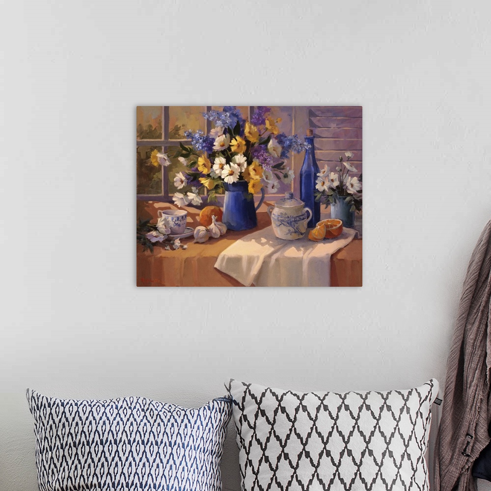A bohemian room featuring Contemporary still-life painting of a decorative vase holding colorful flowers.