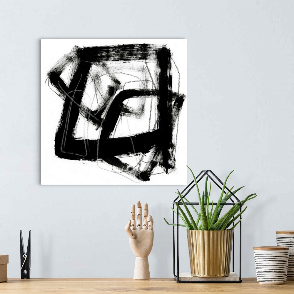 A bohemian room featuring Contemporary abstract painting using bold black contrasting against a stark white background.