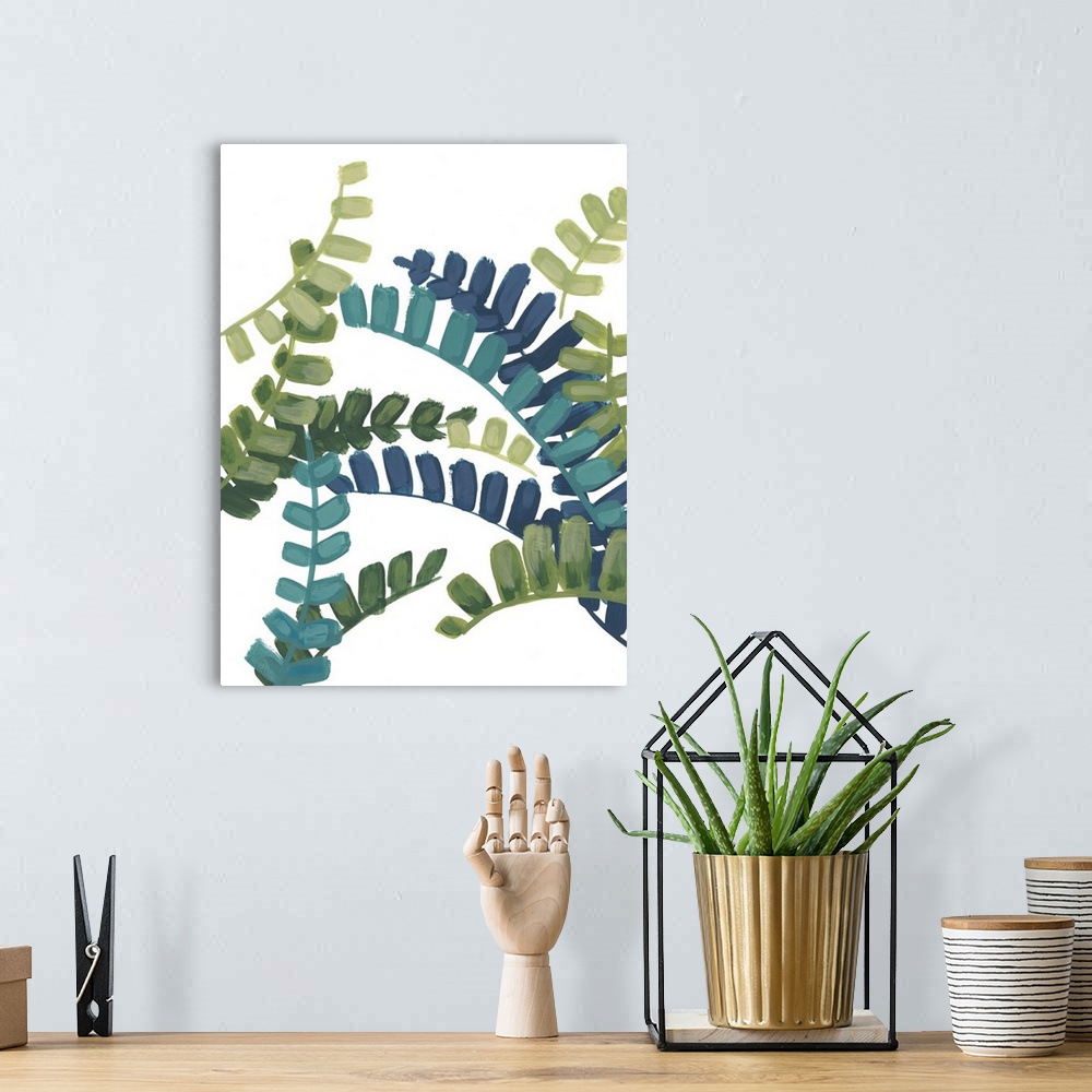 A bohemian room featuring Artwork of green and blue fern fronds on white.