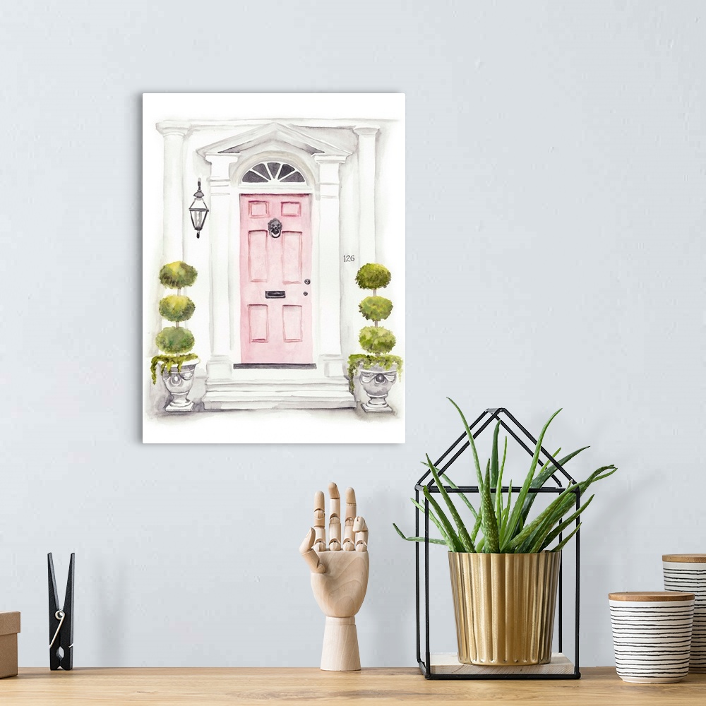 A bohemian room featuring Watercolor artwork of a pink door with white columns and small topiaries.