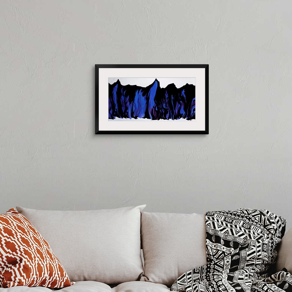 A bohemian room featuring Abstract artwork painting of rhythmic folds done in rich blue tones.