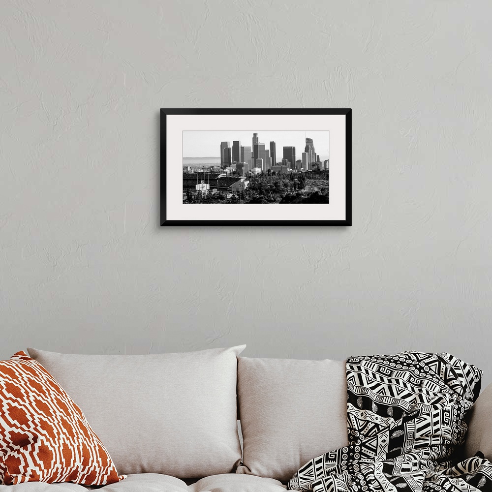 A bohemian room featuring Photograph of the downtown Los Angeles skyline with Dodger Stadium on the left.