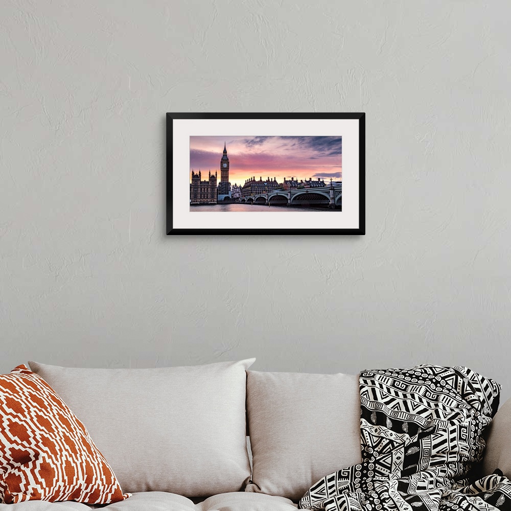 A bohemian room featuring Panoramic photograph of Big Ben and the Westminster Bridge with a pink and purple sunset.