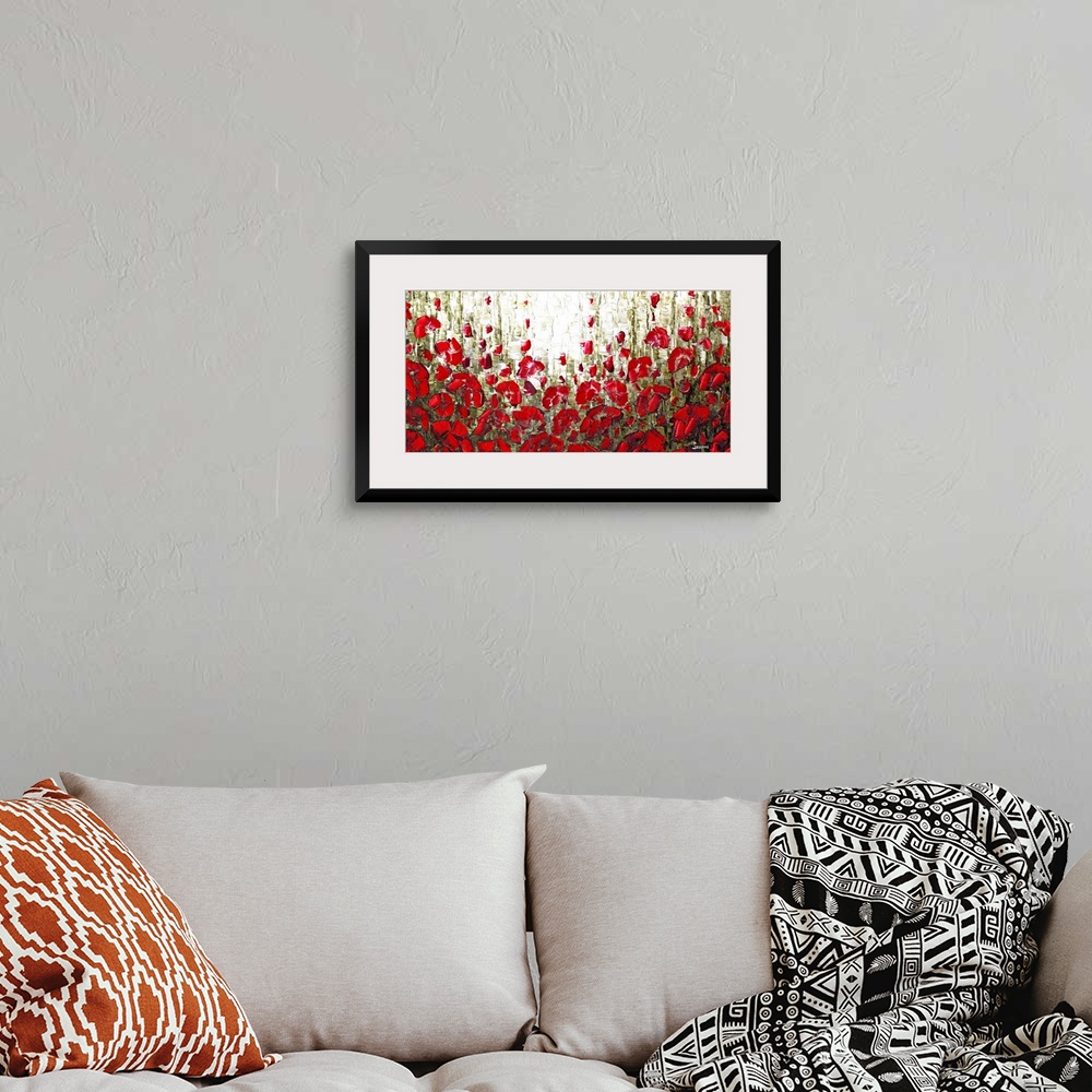 A bohemian room featuring Abstract landscape filled with red poppies.
