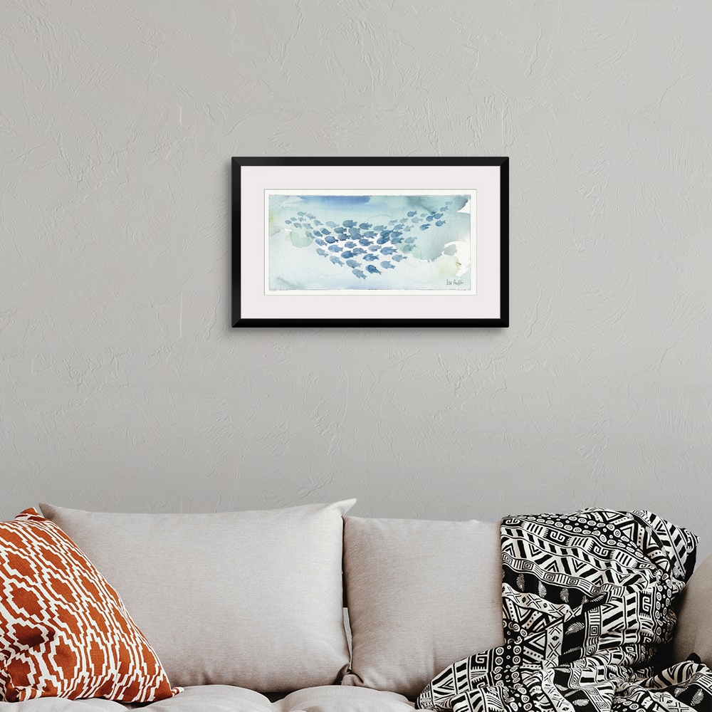 A bohemian room featuring Watercolor painting of a school of fish against a light blue background.